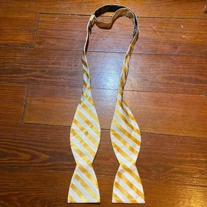 Gold and white striped bow tie